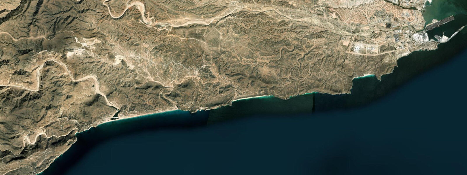 Satellite view of the coast near Mughsayl Beach
